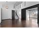 Spacious living room with hardwood floors, staircase, and an open floor plan for seamless entertaining at 96 S Lindsey St, Castle Rock, CO 80104