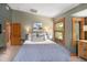 Bright bedroom featuring natural light, a cozy bed, and stylish wooden trim at 1121 S Williams St, Denver, CO 80210