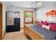 Bedroom with stylish furnishings, a window, and ample storage at 1121 S Williams St, Denver, CO 80210