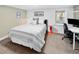 Bedroom with modern decor, a comfortable bed, and a workspace area at 1121 S Williams St, Denver, CO 80210