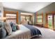 Sunlit bedroom with a vaulted ceiling, large windows, and a balcony at 1121 S Williams St, Denver, CO 80210