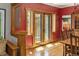 Dining room with hardwood floors, red walls, and french doors leading outside at 1121 S Williams St, Denver, CO 80210