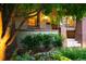 Inviting front entrance showcasing a well-lit porch, brick accents, and lush landscaping at 1121 S Williams St, Denver, CO 80210
