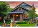 Charming home featuring brick accents, a cozy porch, and well-maintained landscaping in a delightful curb appeal at 1121 S Williams St, Denver, CO 80210