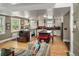 Inviting living room open to kitchen features hardwood floors and windows at 1121 S Williams St, Denver, CO 80210
