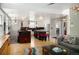 Open concept living and kitchen area with wood floors and stylish décor at 1121 S Williams St, Denver, CO 80210