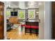 Stylish living room features hardwood floors and large windows with island and seating at 1121 S Williams St, Denver, CO 80210