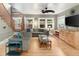 Inviting living room showcasing hardwood floors, natural light, and entertainment center at 1121 S Williams St, Denver, CO 80210