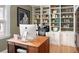 Bright office with large desk and lots of built-in shelving at 1121 S Williams St, Denver, CO 80210
