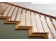 Wooden stairway with natural lighting and detailed trim at 1121 S Williams St, Denver, CO 80210