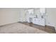 Basement wet bar with white shaker cabinets and quartz countertops at 4022 Arleigh Dr, Berthoud, CO 80513
