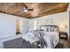 Bright bedroom with wood ceiling and cozy sitting area at 4022 Arleigh Dr, Berthoud, CO 80513
