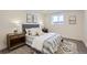 Basement bedroom with wood nightstands and lamps at 4022 Arleigh Dr, Berthoud, CO 80513