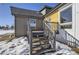 Gray deck with stairs leading to the backyard at 4022 Arleigh Dr, Berthoud, CO 80513