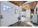Bright entryway with white walls and wood ceiling at 4022 Arleigh Dr, Berthoud, CO 80513