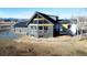 Gray modern home with large windows and deck at 4022 Arleigh Dr, Berthoud, CO 80513