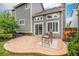 Charming backyard patio with stamped concrete, table, chairs, and well-maintained landscaping at 359 Wessex Cir, Highlands Ranch, CO 80126