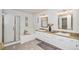 Bright bathroom featuring double vanity, soaking tub and glass enclosed shower at 359 Wessex Cir, Highlands Ranch, CO 80126