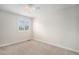 Neutral empty room with ceiling fan and shuttered windows at 359 Wessex Cir, Highlands Ranch, CO 80126