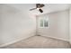Neutral empty room with ceiling fan and shuttered windows at 359 Wessex Cir, Highlands Ranch, CO 80126