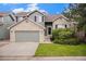 Charming two-story home featuring a brick and siding exterior, a two-car garage, and a well-maintained front yard at 359 Wessex Cir, Highlands Ranch, CO 80126