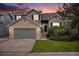 Charming two-story home featuring a brick and siding exterior, a two-car garage, and a well-maintained front yard at 359 Wessex Cir, Highlands Ranch, CO 80126