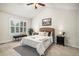 Bright main bedroom features vaulted ceiling, large window and neutral decor at 359 Wessex Cir, Highlands Ranch, CO 80126