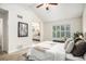 Bright main bedroom has a view of the en suite bathroom, vaulted ceiling and large window at 359 Wessex Cir, Highlands Ranch, CO 80126