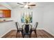 Small dining area with glass top table and four black metal chairs at 2190 E Geddes Ave # E, Centennial, CO 80122