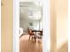 Cozy dining room viewed through doorway, featuring hardwood floors at 1602 Glen Bar Dr, Lakewood, CO 80215