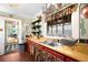 Charming kitchen featuring wood countertops, colorful accents and vintage decor elements at 1602 Glen Bar Dr, Lakewood, CO 80215