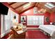 Bright main bedroom with vaulted ceiling, skylight, and unique chandelier at 1602 Glen Bar Dr, Lakewood, CO 80215