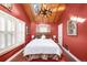 View of the main bedroom featuring a vaulted ceiling, skylight and a distinctive chandelier at 1602 Glen Bar Dr, Lakewood, CO 80215