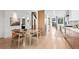 Open-concept living space featuring a dining table, hardwood floors, and modern finishes adjacent to the kitchen at 2725 6Th St, Boulder, CO 80304
