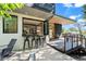 Modern home exterior with outdoor seating, wood accents, and a convenient bar window at 2725 6Th St, Boulder, CO 80304