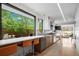 Modern kitchen with a breakfast bar, stainless steel appliances, and an outdoor view at 2725 6Th St, Boulder, CO 80304