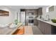 Modern kitchen featuring stainless steel appliances, wood cabinets, and a cozy dining area at 2725 6Th St, Boulder, CO 80304