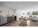 Compact kitchenette with granite countertops and stainless steel appliances in a well-lit space at 2725 6Th St, Boulder, CO 80304