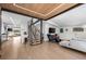 Open concept living space with modern staircase, sleek wood ceiling, and TV area at 2725 6Th St, Boulder, CO 80304