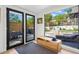 Bright sunroom with a view of the landscaped yard and modern outdoor seating at 2725 6Th St, Boulder, CO 80304