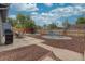 Expansive backyard with patio, hammock, gravel area, and mature landscaping, perfect for outdoor enjoyment at 1275 S Wolff St, Denver, CO 80219