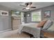 Bedroom featuring plush carpeting, neutral walls, and a ceiling fan for added comfort at 1275 S Wolff St, Denver, CO 80219