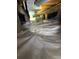 View of the encapsulated crawlspace with vapor barrier and wooden beams supporting the home at 1275 S Wolff St, Denver, CO 80219