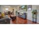 Comfortable living area boasts hardwood floors, an open layout, and access to the dining room at 1275 S Wolff St, Denver, CO 80219