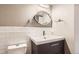 Stylish bathroom featuring modern vanity, fixtures, and ample lighting at 3659 W Union Ave, Denver, CO 80236