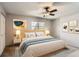 Bright bedroom with ceiling fan, soft lighting, and stylish decor at 3659 W Union Ave, Denver, CO 80236