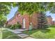 Charming brick home with well-manicured lawn and mature landscaping at 3659 W Union Ave, Denver, CO 80236