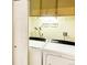 Functional laundry room with washer, dryer, and playful decor at 3659 W Union Ave, Denver, CO 80236