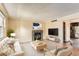 Cozy living room features fireplace, neutral decor, and an open floor plan at 3659 W Union Ave, Denver, CO 80236