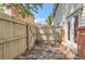 Outdoor brick patio enclosed with a wooden fence at 3659 W Union Ave, Denver, CO 80236